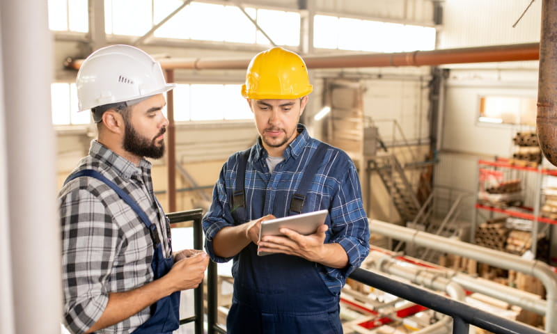 an inspector teaching a warehouse safety manager<br />
