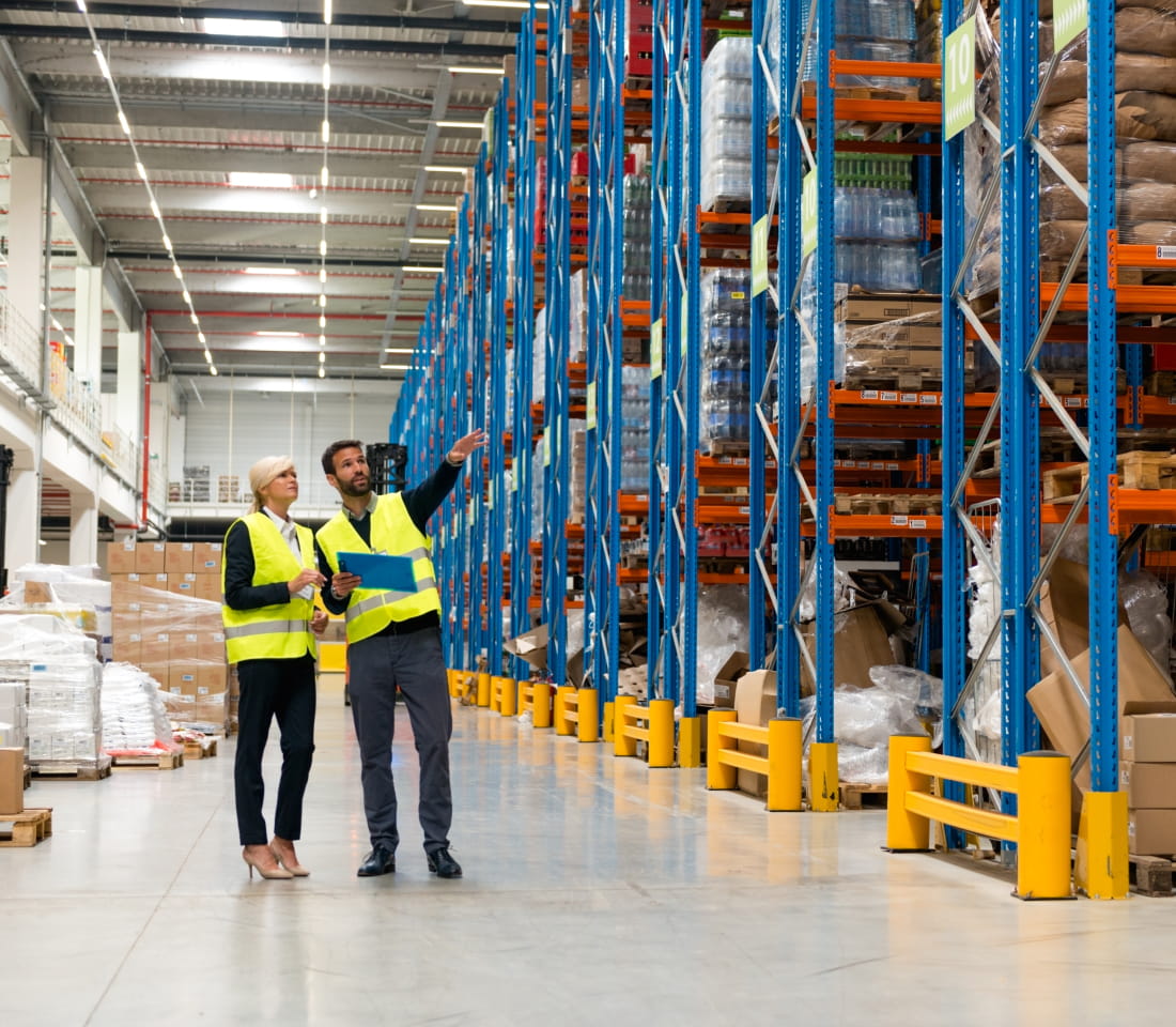 Two team members working on a warehouse racking inspection